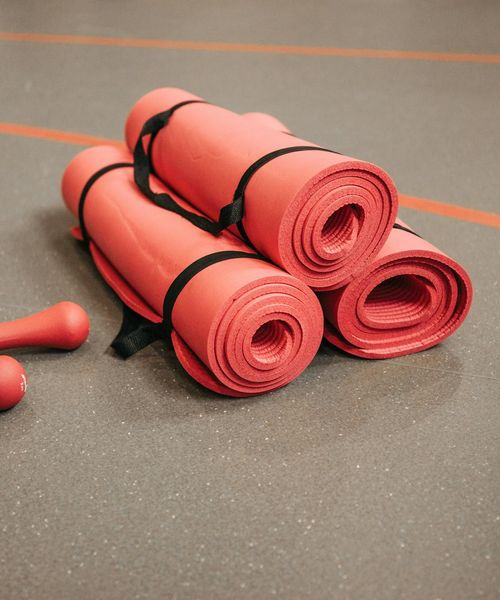 Minimalist setup with a yoga mat and blocks for stability training